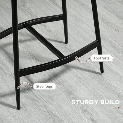 Bar stool with black steel legs and a crossbar footrest