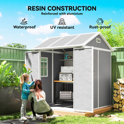 Grey resin garden shed with open double doors, shelves and stored items inside