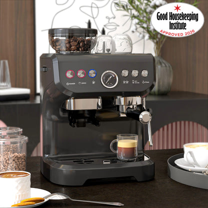 Black espresso machine with bean hopper, portafilter, steam wand and cup brewing espresso
