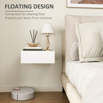 White floating bedside table mounted beside a bed.