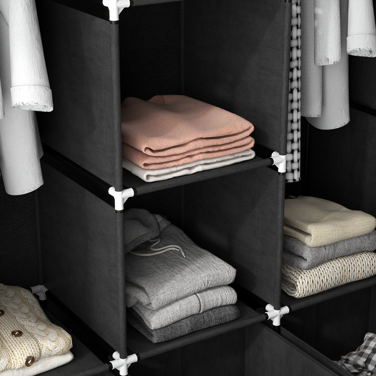 Black fabric wardrobe shelves holding folded clothing