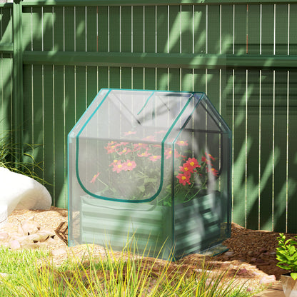 Green raised planter bed with clear greenhouse cover and blooming flowers