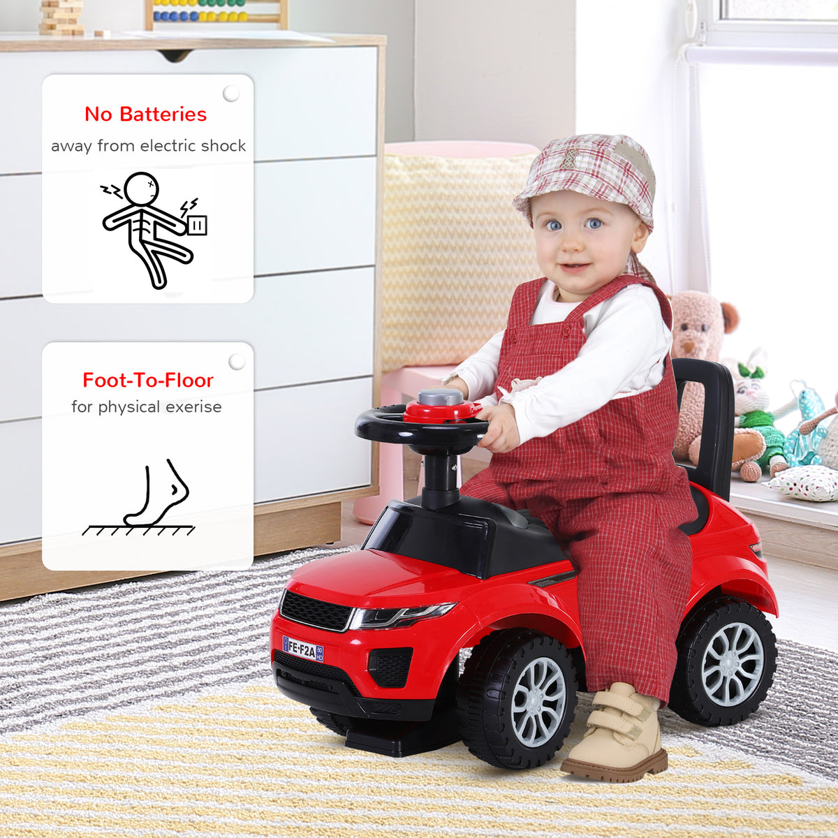 Toddler riding a red foot-to-floor car with steering wheel and backrest