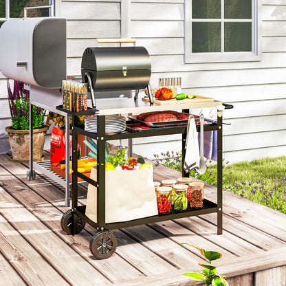 Outdoor barbecue trolley with stainless steel top, two shelves, wheels and accessories
