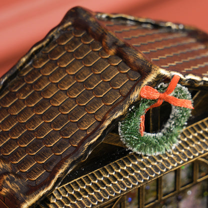 Close-up of lantern roof shingles and green wreath with red bow