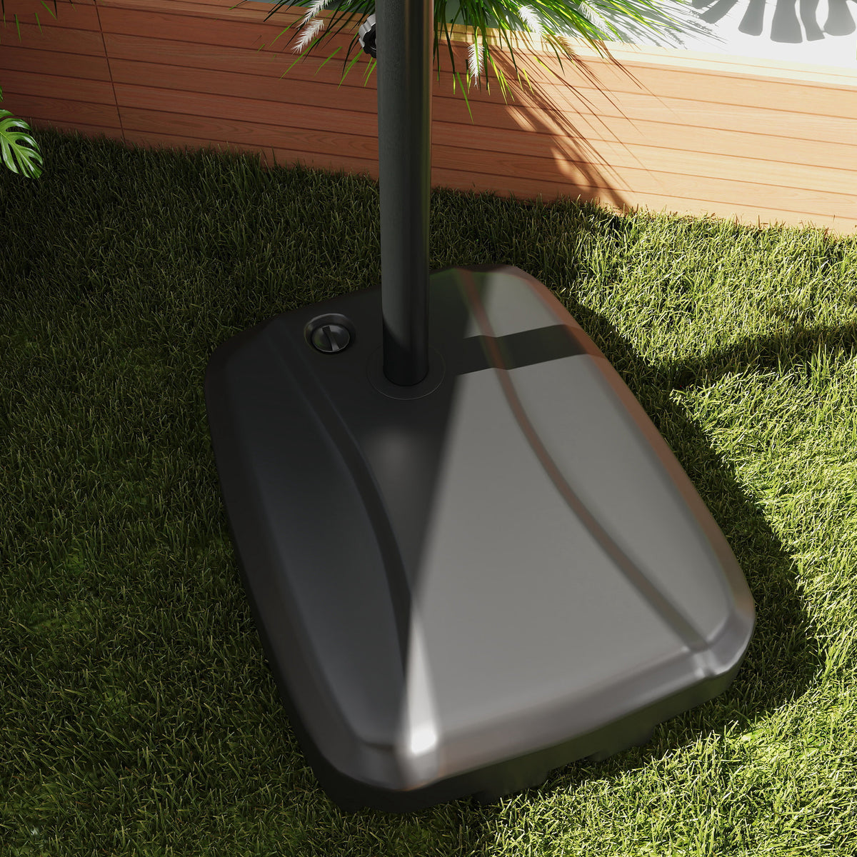 Close-up of the dark weighted base and pole of a cantilever patio umbrella