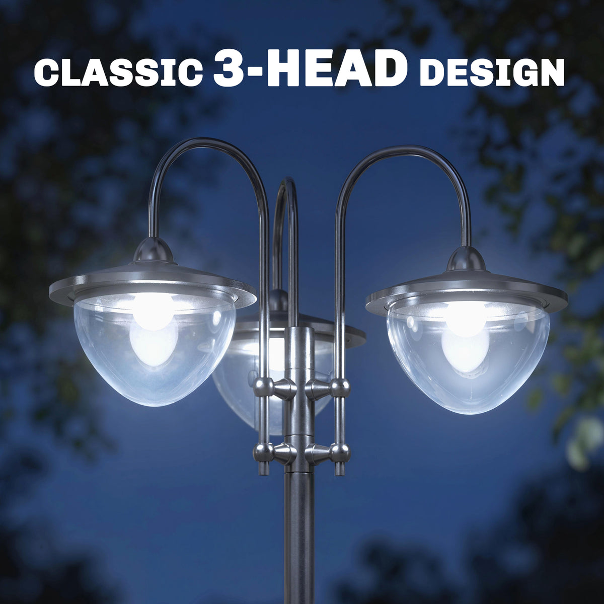 Close-up of three curved lamp heads with clear glass shades and bright LED bulbs