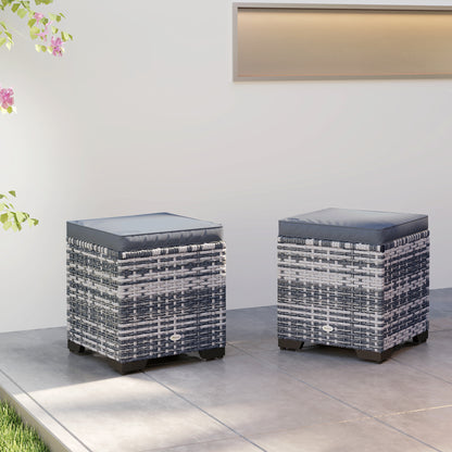 Two dark gray rattan ottomans with square padded cushions