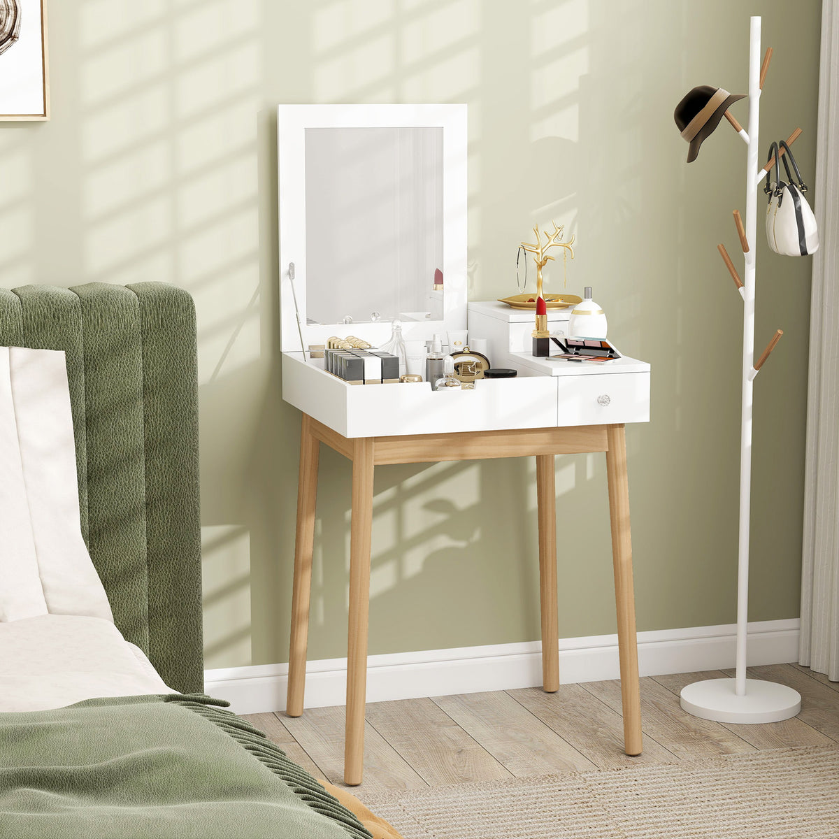 White vanity table with upright mirror, storage compartments, and pine legs