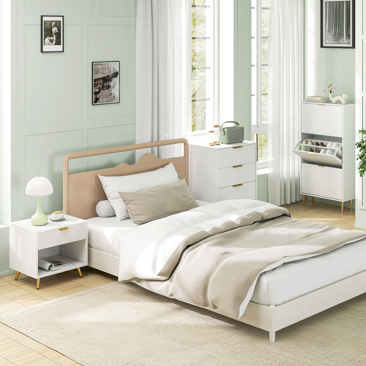 White bedside table with gold-tone legs beside a bed