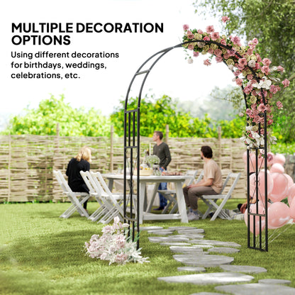 Black steel garden arch decorated with flowers and balloons for an outdoor gathering