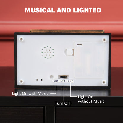 Musical snow globe lantern with underside speaker, battery compartment, and mode switch