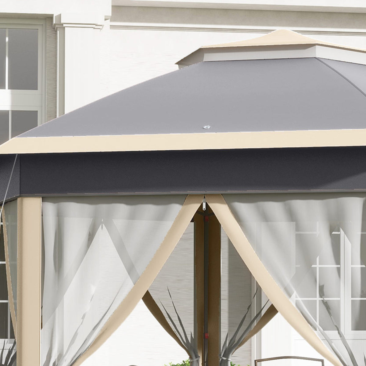 Close-up of gazebo's double roof and tied-back mesh curtains