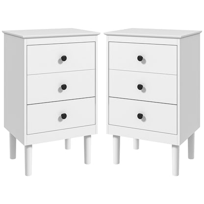 Pair of white three-drawer bedside tables with black knobs and tapered legs