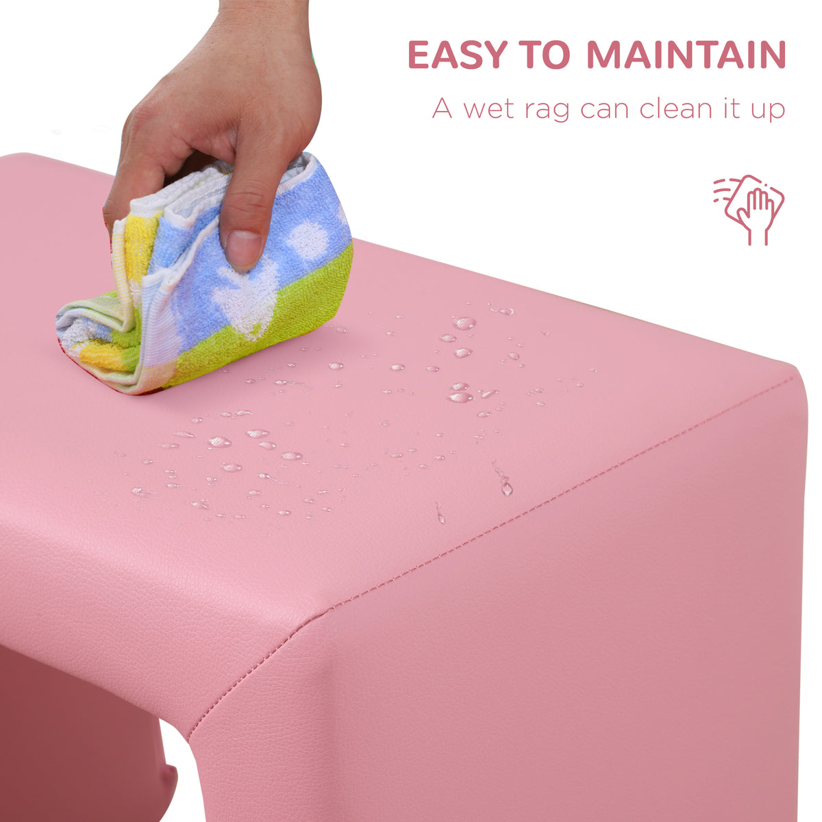 Pink toddler sofa chair surface being wiped clean with a damp cloth