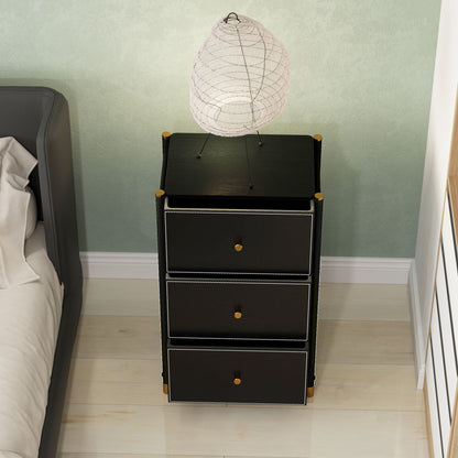 Black three-drawer chest viewed from above, with all drawers open