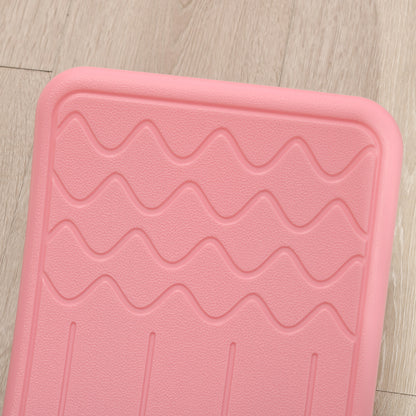 Close-up of the pink balance board's raised wavy texture and molded foot grip.