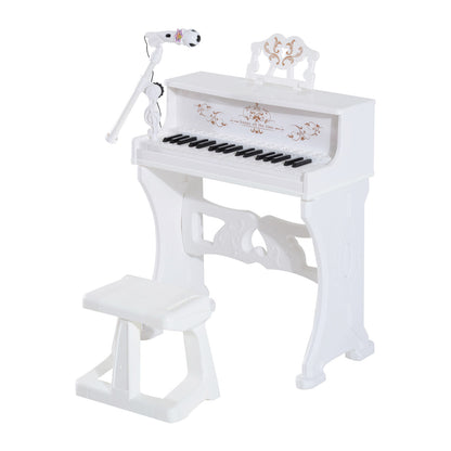 White toy grand piano set with 37 keys, matching stool, adjustable microphone and ornate music stand.
