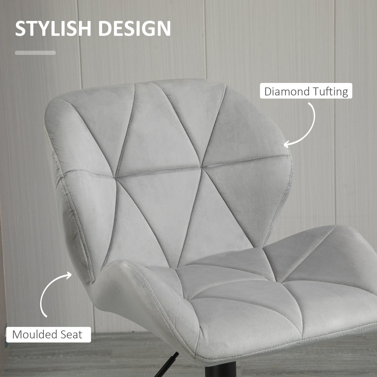 Close-up of light gray bar stool's diamond-tufted, moulded velvet-touch seat