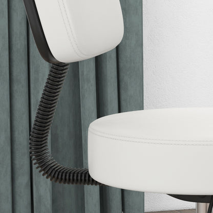 Close-up of the white salon chair's padded seat and flexible backrest support