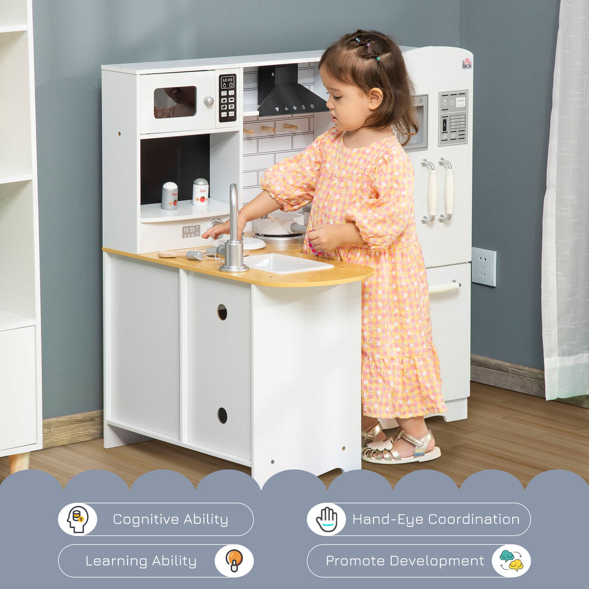 HOMCOM white pretend kitchen with sink, stove and refrigerator, shown in use by a child
