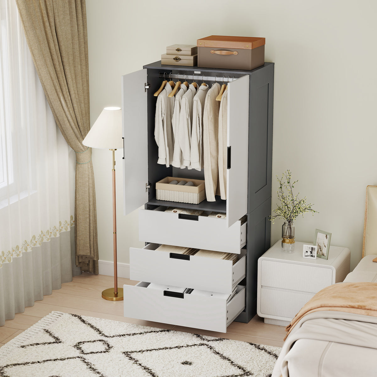 Open wardrobe with clothes on the hanging rail and three drawers pulled out.