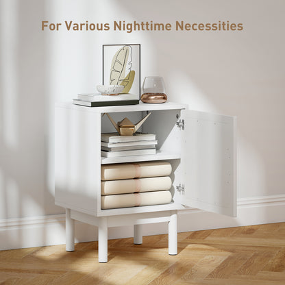 Open white bedside table showing two storage shelves behind its door