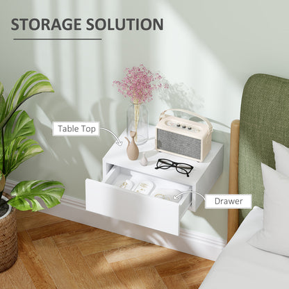 White wall-mounted nightstand with its storage drawer open.