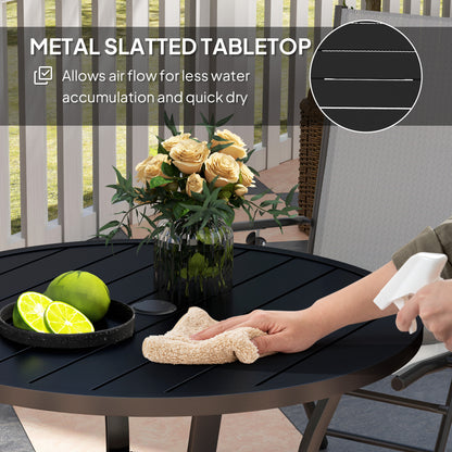 Outsunny black round table with slatted metal top, shown being wiped clean