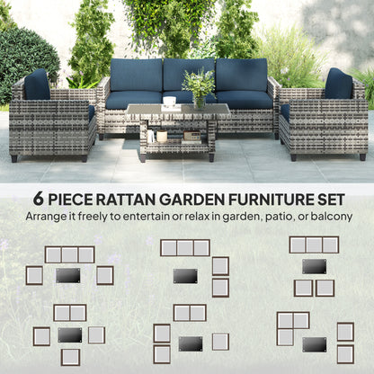 Six-piece rattan garden sofa set arranged around a coffee table, with navy cushions