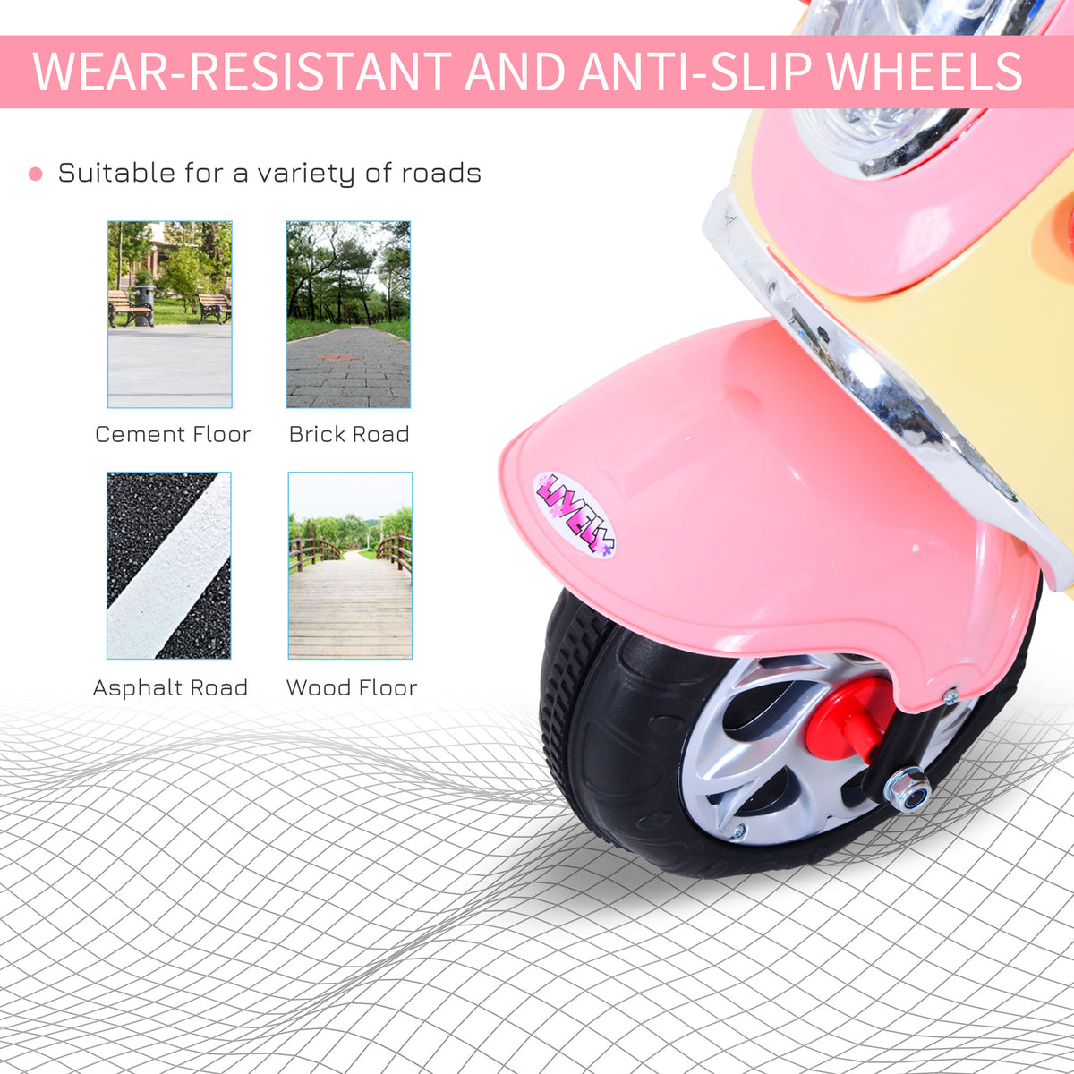 Close-up of the scooter's pink front fender and black tire with silver wheel