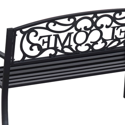 Rear view of the black steel bench’s ornate backrest and slatted seat