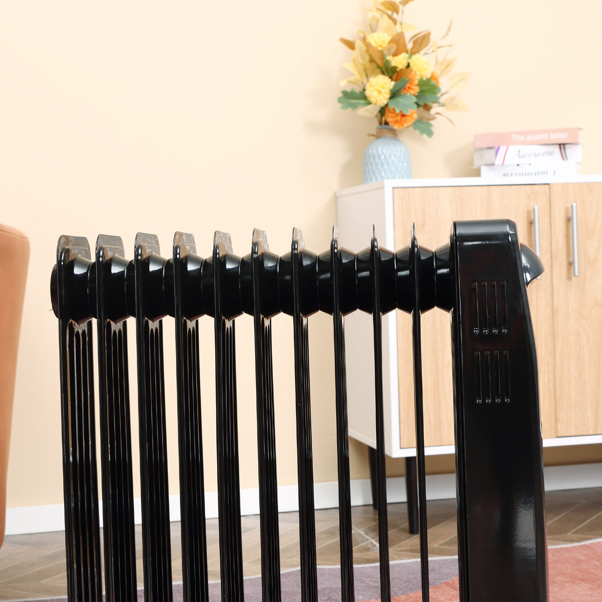 HOMCOM radiator heater side view showing its row of black heating fins
