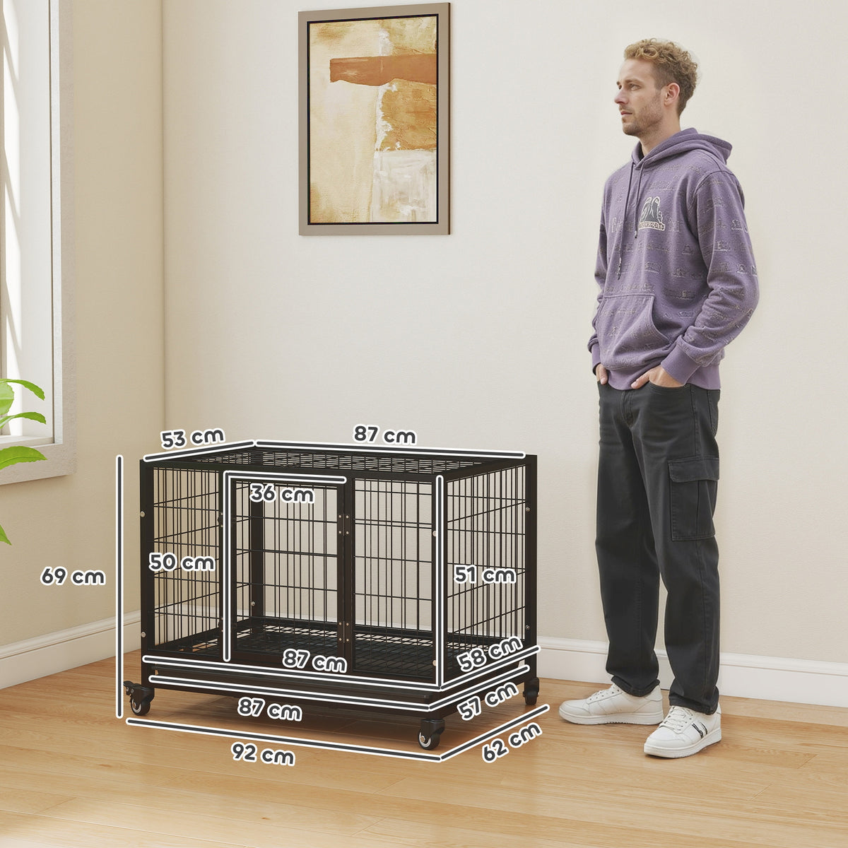 Black wheeled metal dog crate with labeled dimensions and a front door