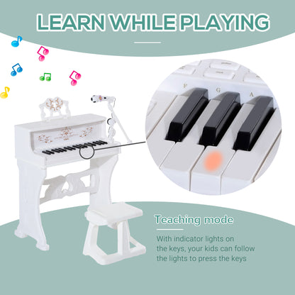 White toy piano with light-up keys and teaching mode that guides children as they play.