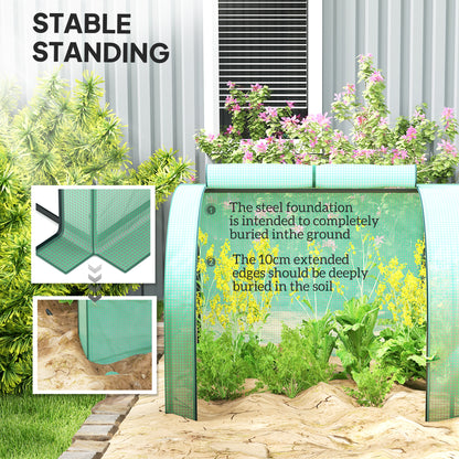 Green low tunnel greenhouse with cover edges buried in soil for stability