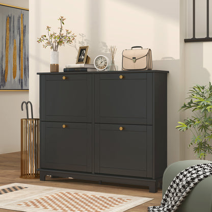Black shoe cabinet with four closed flip drawers and gold knobs.