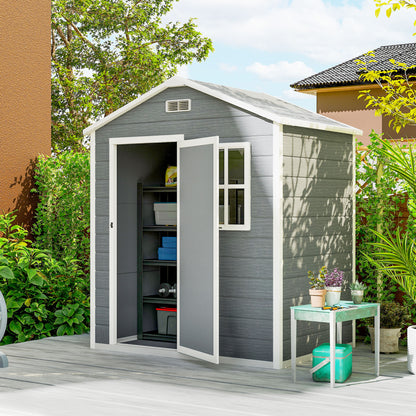 Grey resin garden shed with open door revealing storage shelves and a side window