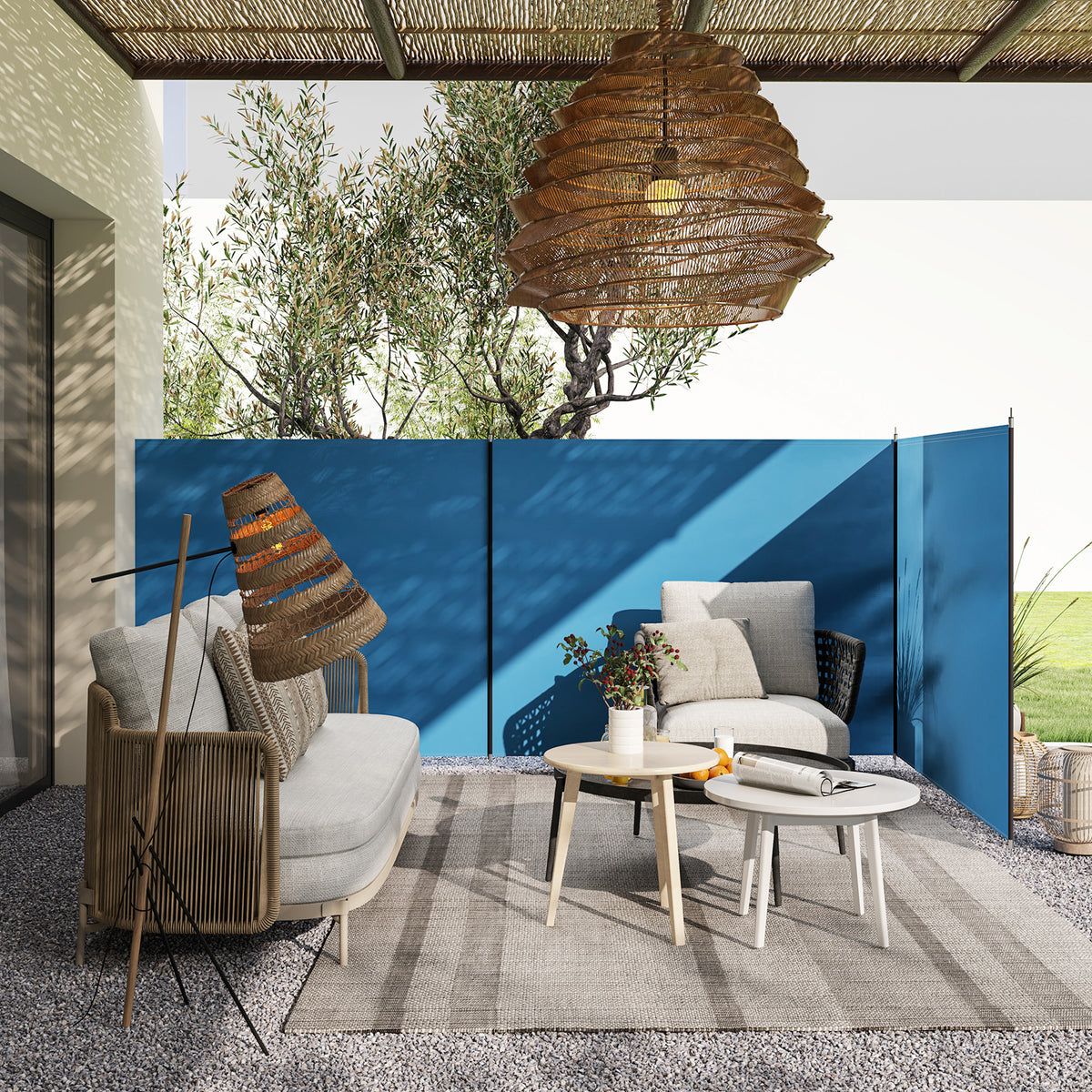 Blue three-panel windbreak arranged around outdoor seating