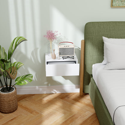 White floating bedside table with a partially open drawer.