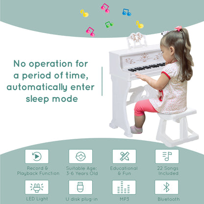 White kids' electronic piano with stool, microphone and music stand; keys light up for learning.