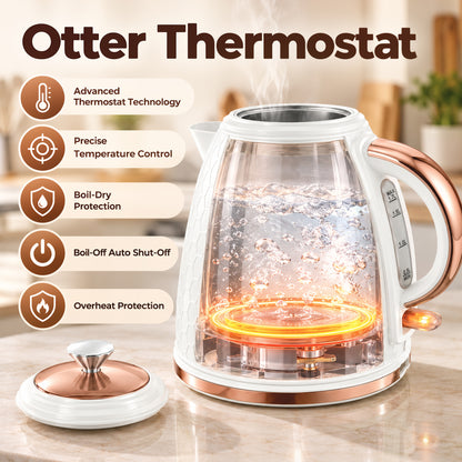Clear glass electric kettle with rose gold handle, visible heating element, and removable lid