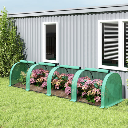 Green low tunnel greenhouse with mesh sides and flowering plants inside