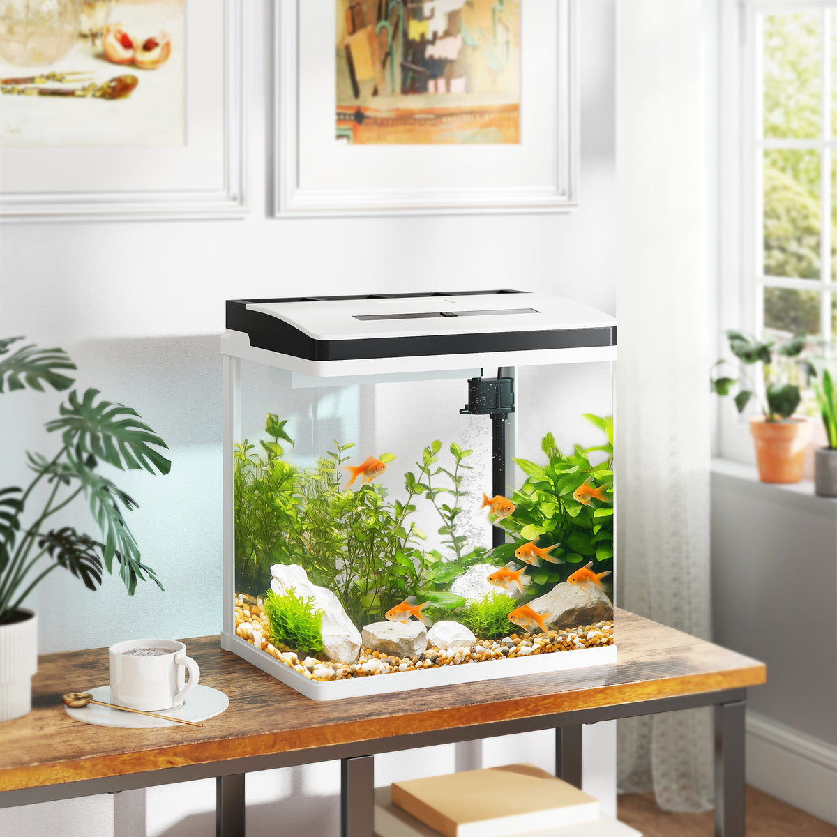 PawHut glass aquarium with black-and-white lid, filter, plants, gravel, rocks, and orange fish