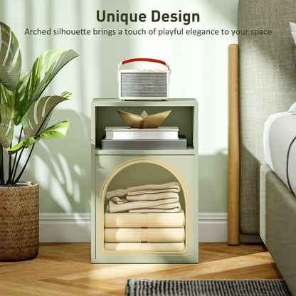 Light green bedside table with folded linens in its arched lower compartment