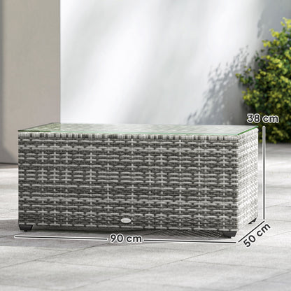 Rattan side table with glass top, measuring 90 by 50 by 38 cm