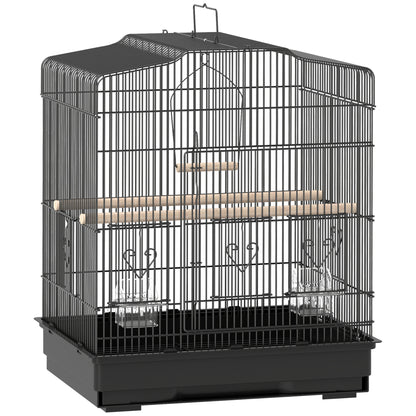 Black metal bird cage with wooden perches, food cups, swing, and removable base tray