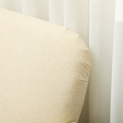 Close-up of the cream loveseat's textured fabric upholstery and rounded back corner