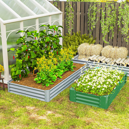 Silver corrugated steel raised planter filled with vegetables beside a smaller green planter