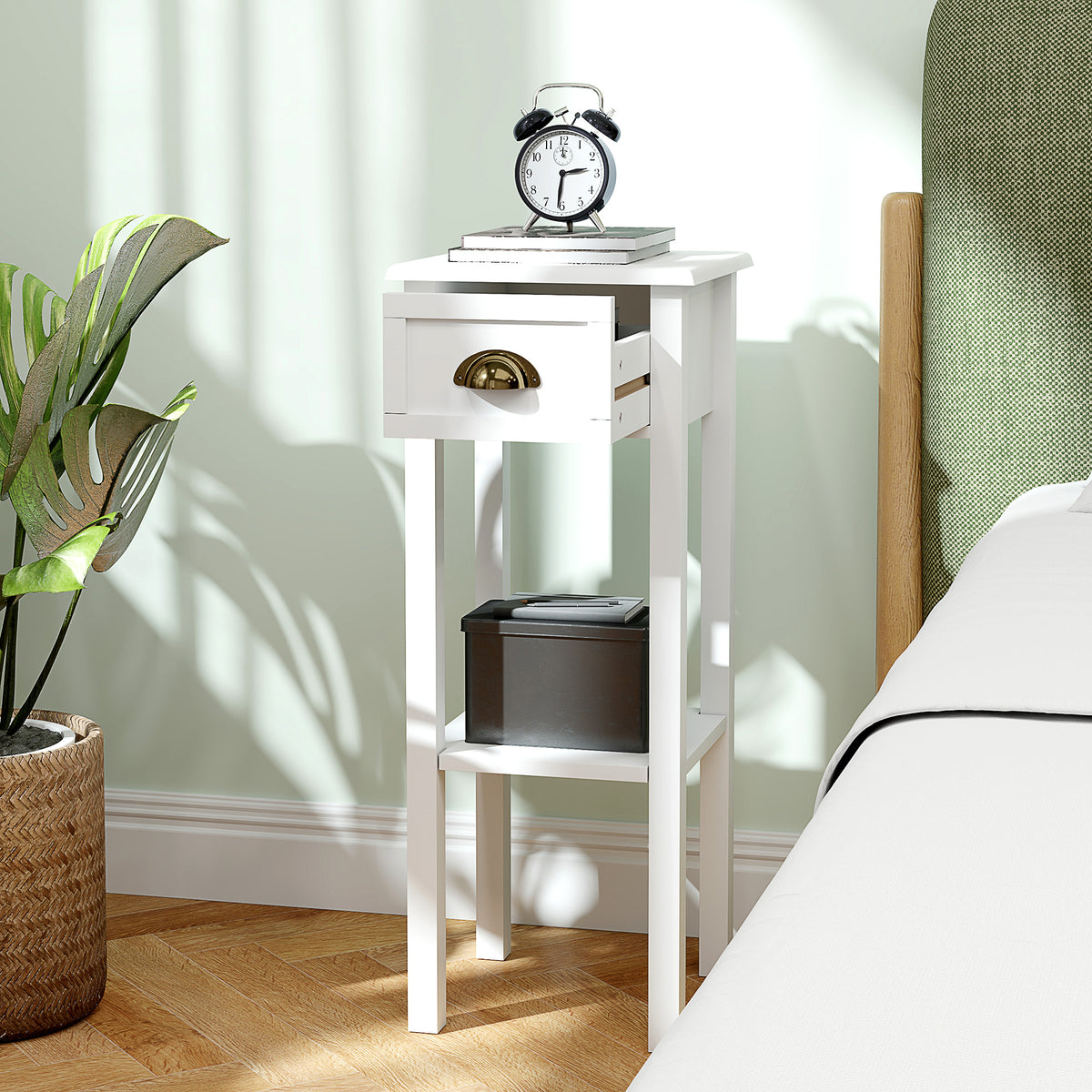 White side table with a drawer, bronze-tone pull, and open lower shelf